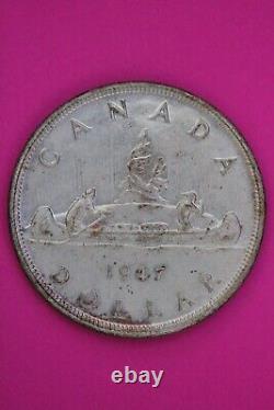 Toned 1947 Blunt 7 Canada Silver Dollar Scarce Semi Key Date. 800 Fine Coin 39