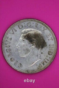 Toned 1947 Blunt 7 Canada Silver Dollar Scarce Semi Key Date. 800 Fine Coin 39